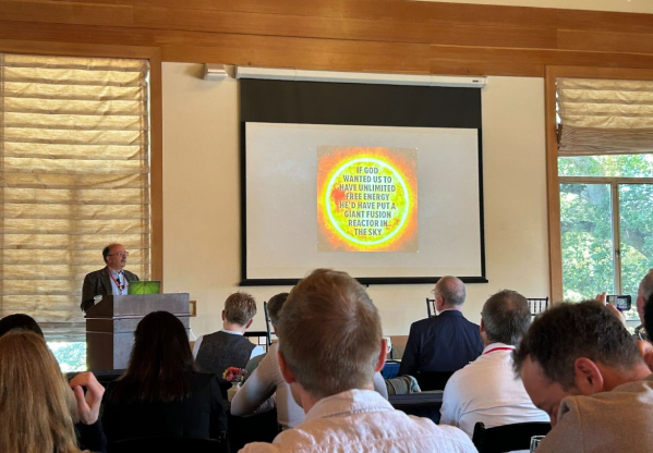 [Alt text] Attendees listen to a talk at the Living Laboratories Summit