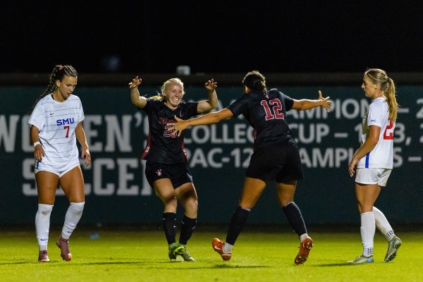 Logan Smith and Jasmine Aikey during a match against Southern Methodist University at Maloney Field at Laird Q. Cagan Stadium on October 25. Smith and Aikey were among the seniors honored before Stanford's final home game of the regular season. (Photo: MATTHEW HUANG/ISI Photos)