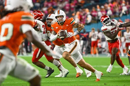 Sixth year redshirt quarterback Carson Beck rolls out of the pocket against Louisville on Oct. 17, 2025. (Photo courtesy of David Lebowitz)