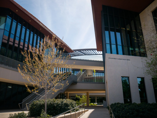 The exterior of the Chem-H building at Stanford with a tree in front.