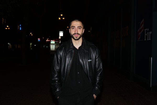 [Alt text]: Ali Ansari poses for a photo