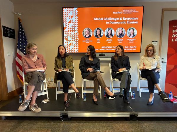 Democracy Action Lab scholars sit on stage.