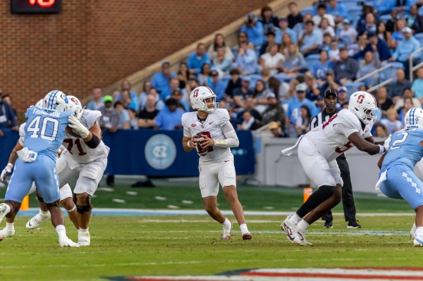 Elijah Brown catches the snap in the first quarter during a game against the University of North Carolina on Nov. 8. Brown was sacked nine times in the matchup. (Photo courtesy of Ian Graham)