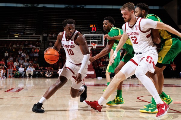 Chisom Okpara and Aidan Cammann during a game against the University of Oregon at Maples Pavilion on October 30. Stanford won the exhibition game against the Ducks 78-70 and will begin regular season play this week. (Photo: BOB DREBIN/ISI Photos)