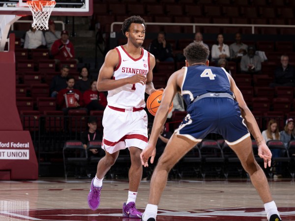 Ebuka Okorie brings the ball up the court during a game against Montana State at Maples Pavilion on Nov. 12. Okorie leads all freshman across the country in scoring this season. (Photo: AL CHANG/ISI Photos)