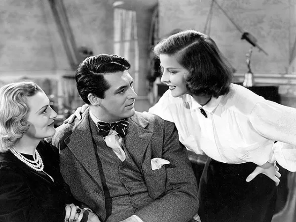 A black-and-white production still from "Holiday" (1938), featuring Katharine Hepburn and Cary Grant.