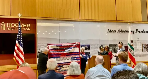 A quilt is presented to a Vietnam War veteran