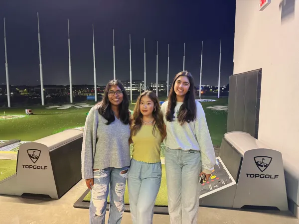 An image of three members of the Stanford Club Golf team. (Courtesy of Araha Uday)