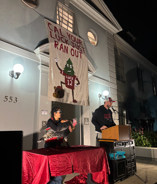 Andrew Luck ’12 M.A. ’23 delivered a speech to spare a turkey on loan from a nearby farm. (Photo: MARA HANKINS/The Stanford Daily)