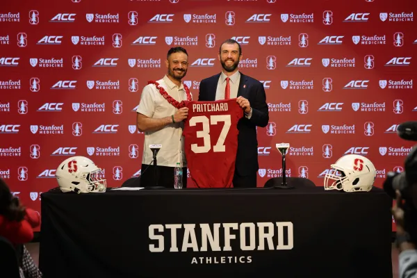 Tavita Pritchard and Andrew Luck during an introductory press conference on Tuesday. Pritchard, former Stanford teammate of Luck, was named as the program's new head coach on Friday. (Photo: BOB DREBIN/Stanford Athletics)