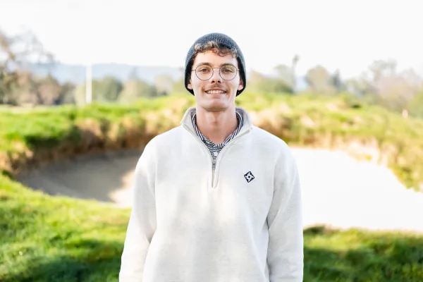 Henry Boeschen '27 at the Stanford Golf Course, where he is the only student to serve as a greenskeeper.  Boeschen's job calls for very early mornings on the course. (PHOTO: CAYDEN GU/The Stanford Daily)