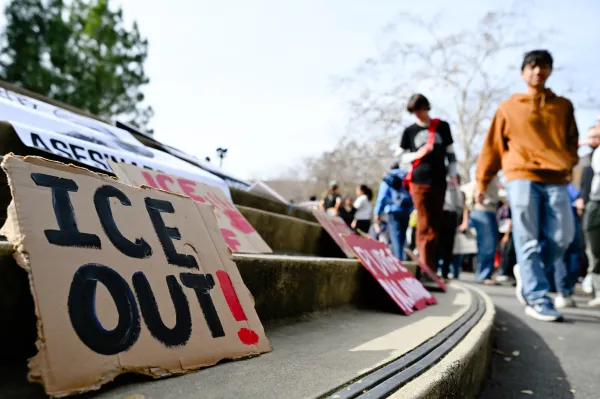 A poster reading "ICE Out!" rests on the stairs of White Plaza following a protest on Friday, Jan. 30.