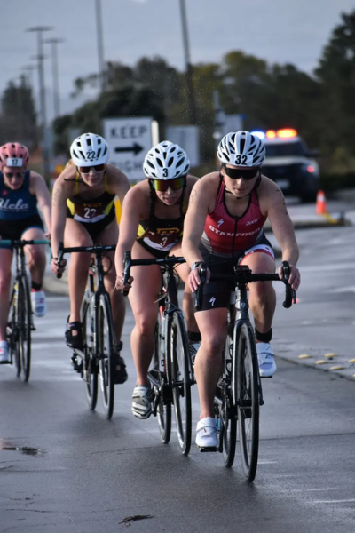 Collegiate triathletes compete in the bike segment of the 2025 Stanford Treeathlon race. (Courtesy of Mathis Hayer)