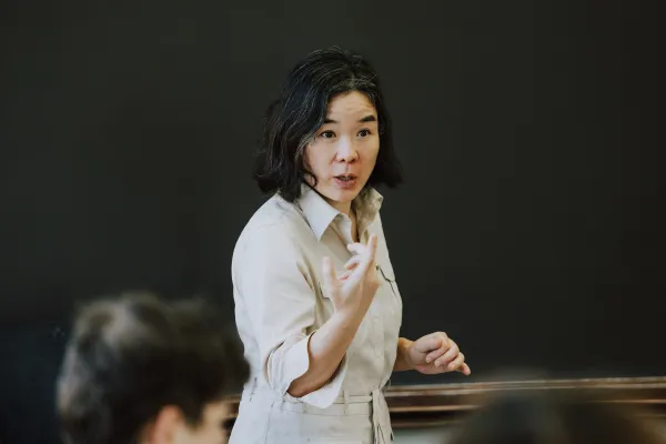 A picture of the author, Professor Pauline Lee teaching in a class.