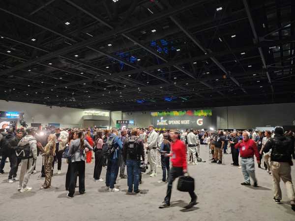 People walking in convention center.
