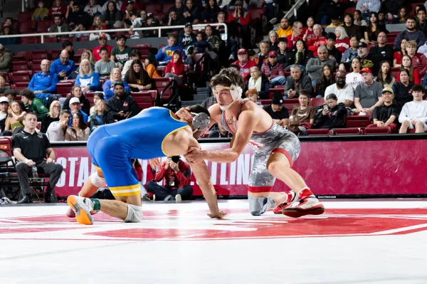 Freshman Angelo Posada in match versus Pitt's Mac Stout