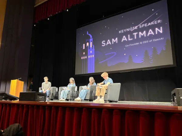 Sam Altman with TreeHacks organizers on stage at Memorial Auditorium