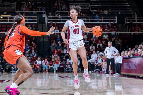 Courtney Ogden dribbles ball in front of Clemson defender.