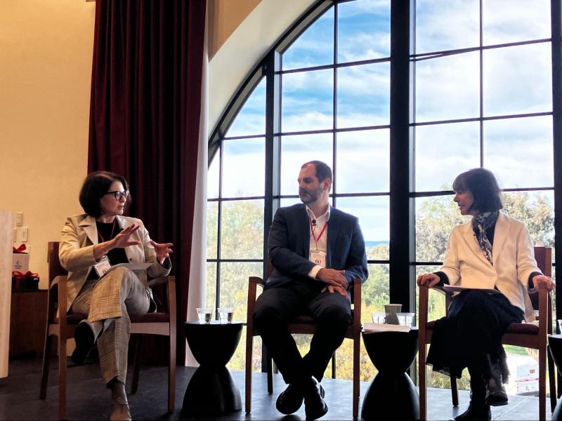 Bing Nursery School celebrates 60 years of research 1 Panelists sit on a wood stage.