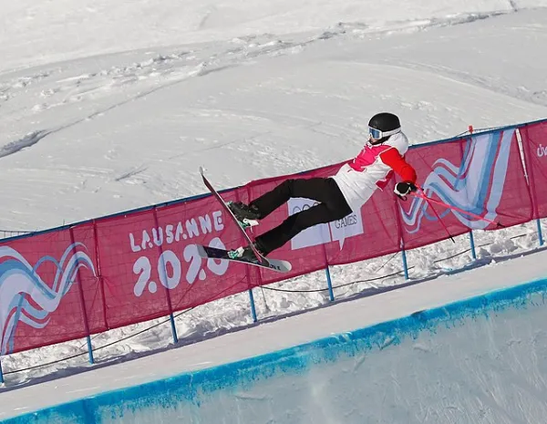 Eileen Gu soars above the snow in a display of her freestyle skiing abilities.