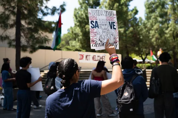 A protester holds a sign.