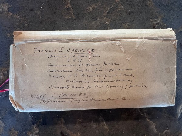 The envelope with a handwritten explanation of its contents: an address to Stanford University commemorating Leland Stanford.
