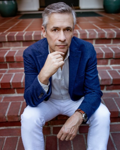 Photo of Alexander Nemerov sitting on brick steps
