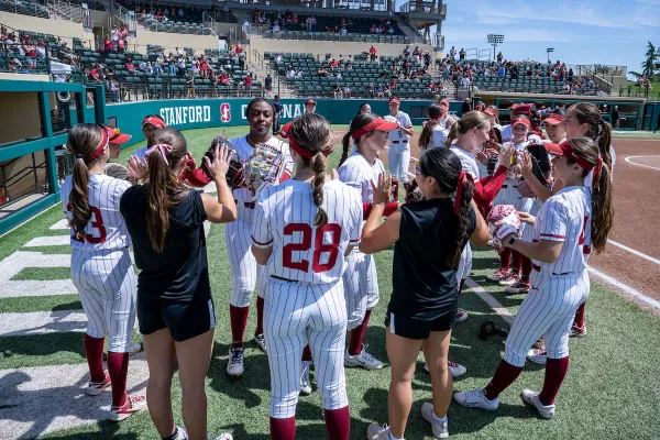 Stanford softball players before a game against North Carolina State University at Stanford Softball Stadium on April 19. (Photo: LYNDSAY RADNEDGE/ISI Photos)