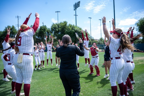 A group of softball players cheering