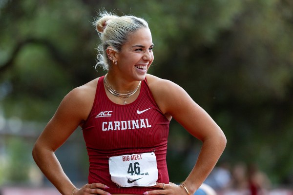 Sydney Barta smiles in her Track and Field uniform