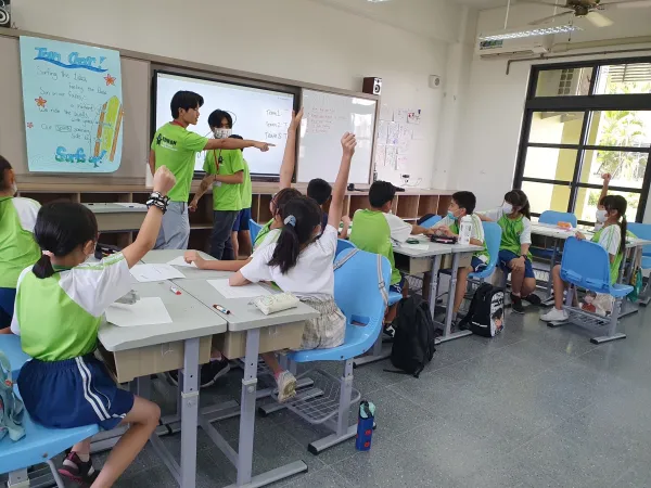 Yang teaches a classroom of elementary school students in Taiwan.