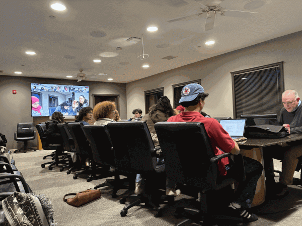 The UGS sits at a conference table.