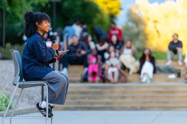 Mia Clark speaks in front of a crowd