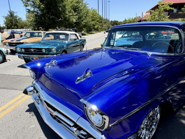 Blue car parked in parking lot.