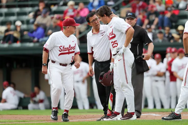 Tomoo Yamada checks up on a player during a game against the University of Utah at Klein Field, Sunken Diamond Stadium on March 26, 2017