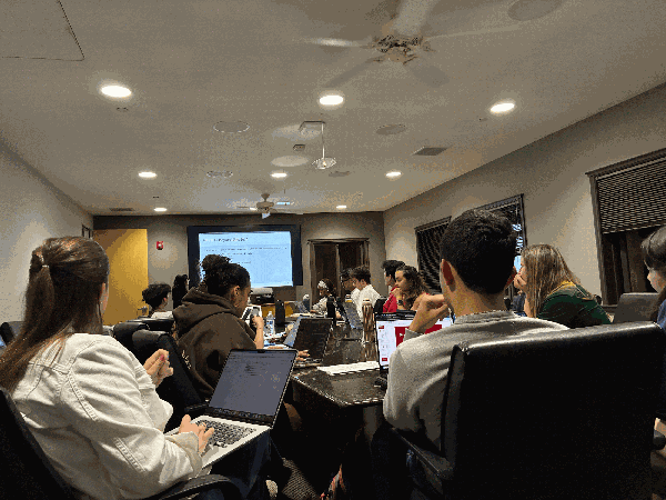 UGS members sit around a conference table.