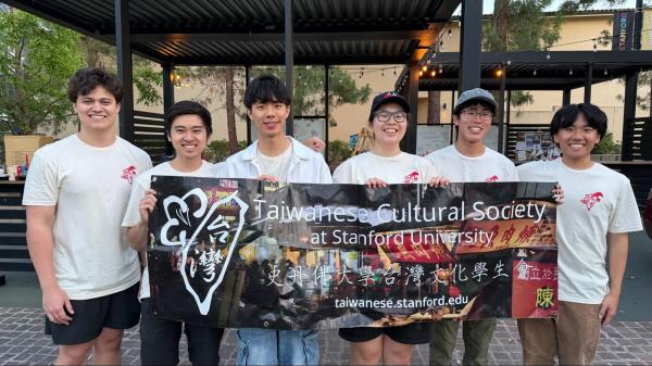 Taiwanese Cultural Society (TCS) members stand with a group sign at their annual Night Market May 23. (Courtesy of Milian Chen)