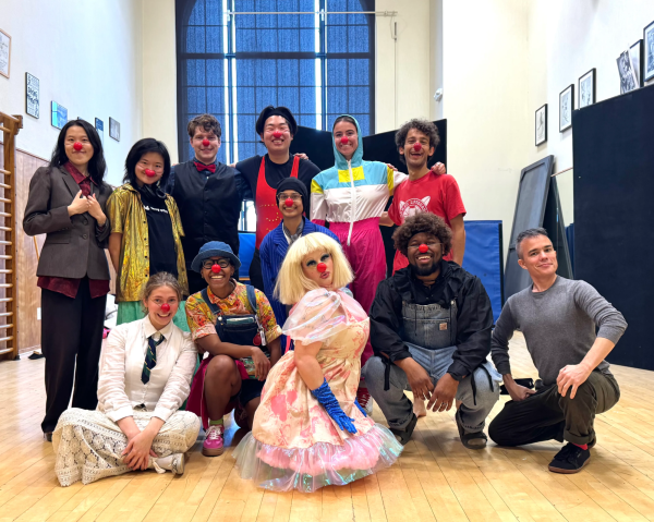 Students pose for a group photo with clown noses on.