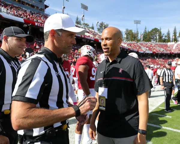 Cory Booker, United States Senator and former Stanford football player, talks with refs before a football game against the University of Colorado at Stanford Stadium on Oct. 22, 2016. Booker has been a loud voice against the PCSA. (Photo: BOB DREBIN/ISI Photos)