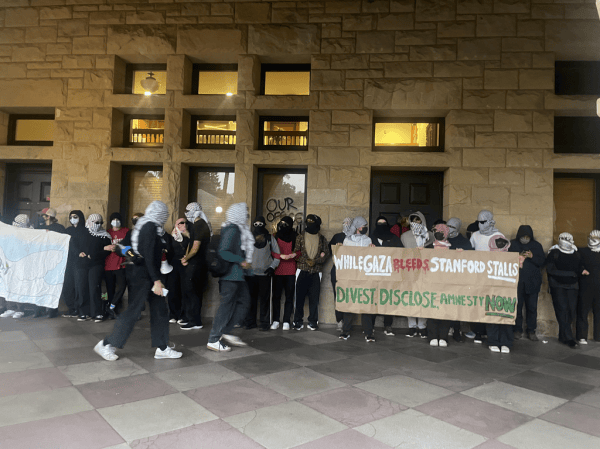 Protestors stand outside main quad.