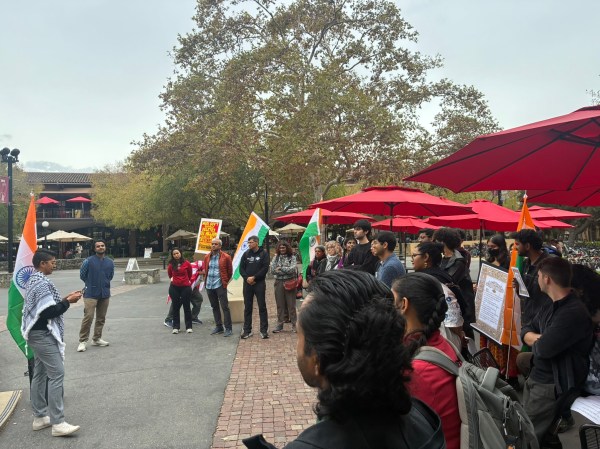 Protestors gather and listen to speaker at White Plaza