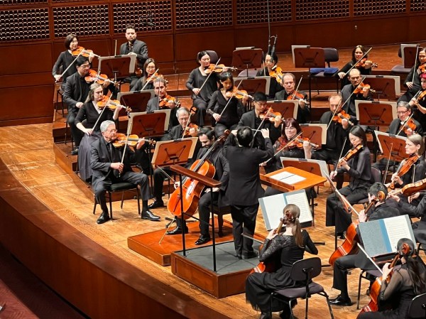 Cellist Pablo Ferrández readies himself as the strings raise their bows to play the first note.