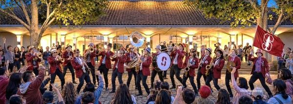The Campus Center project photo featured an all-white, all-male band playing in front a new building.