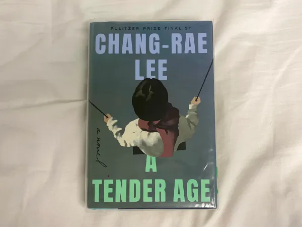 Chang-Rae Lee's novel, "A Tender Age," sitting against a white backdrop.