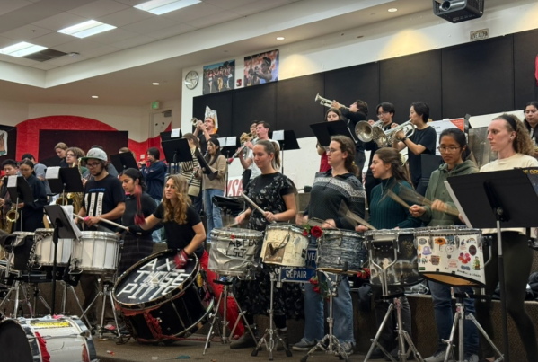 Members of Stanford's band play their instruments in band practice room