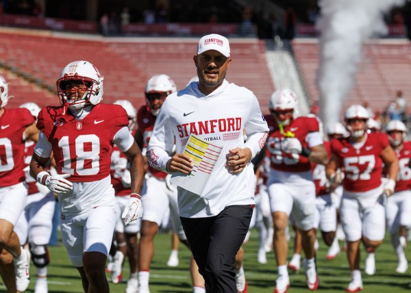 Head coach Tavita Pritchard jogging out with the Stanford Football team.
