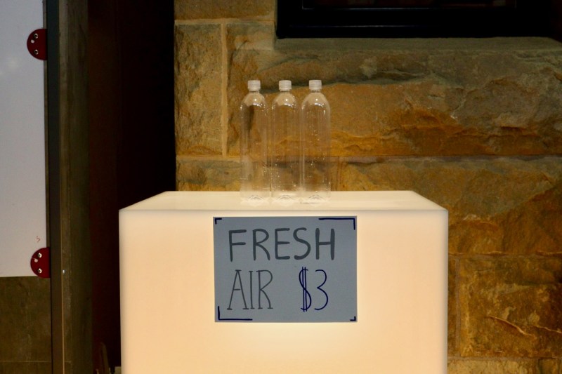 Inaugural Eco-Gala connects climate change and creativity 5 An exhibit featuring three empty bottles and a sign that reads "Fresh Air $3."