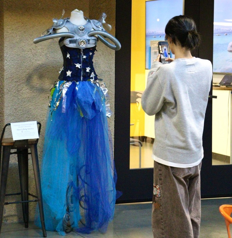 Inaugural Eco-Gala connects climate change and creativity 3 Organizer J Li observes an upcycled dress.