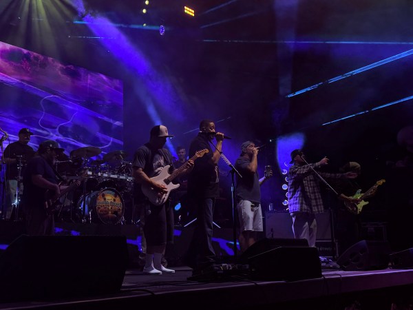 Several bands' under dark blue lighting.